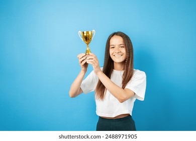 Trophy Award, teenage girl with Cup prize in hands, win competition victory,student achievement reward - Powered by Shutterstock