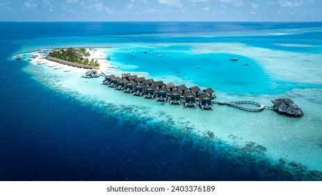 The Tropical aerial view with maldives paradise scenery seascape with water villas as amazing sea and lagoon beach, Exotic tourism - Powered by Shutterstock