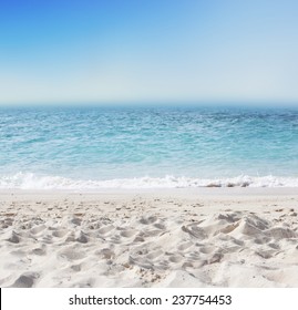 Tropical Background With White Sand Beach, Blue Sea And Perfect Sky