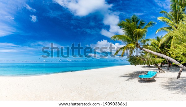 Tropical beach background as summer relax\
landscape with beach swing or hammock and white sand and calm sea\
for beach template. Amazing beach scene vacation and summer holiday\
concept. Luxury travel