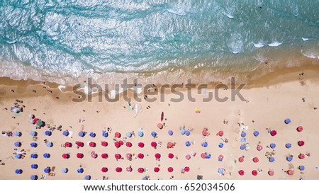 Similar – Luftaufnahme von fliegenden Drohnen von Menschen, die sich am Algarve Beach in Portugal entspannen.