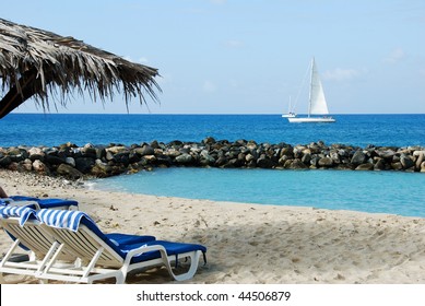 Tropical Beach On St Maarten With Sailboat