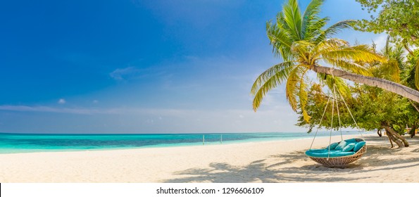 Tropical Beach Panorama As Summer Landscape With Beach Swing Or Hammock And White Sand And Calm Sea For Beach Banner. Perfect Beach Scene Vacation And Summer Holiday Concept. Boost Up Color Process 