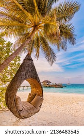 Tropical beach sunset as summer landscape with luxury resort beach palm swing hammock, sand seaside shore for sunset beach landscape. Tranquil beach horizon scenery vacation and summer holiday concept - Shutterstock ID 2136483545
