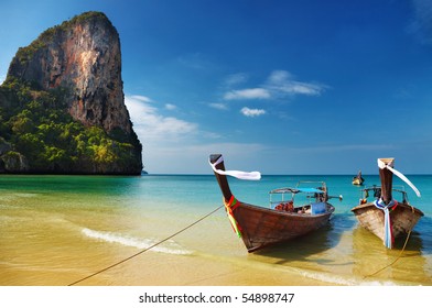 Tropical beach, traditional long tail boats, Andaman Sea, Thailand - Powered by Shutterstock