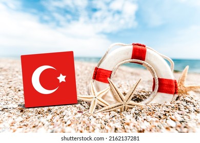 Tropical Beach With Turkey Flag. The Concept Of A Paradise Vacation On The Beaches Of Turkey.