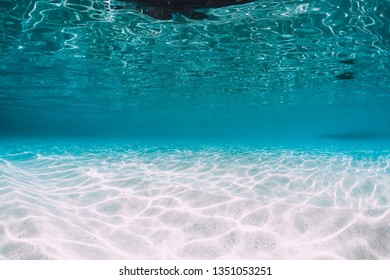 Tropical Blue Ocean With White Sand Underwater In Hawaii