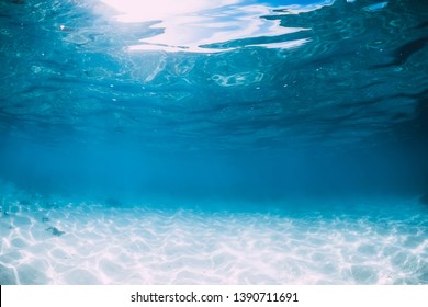 Tropical blue ocean and white sand underwater in Hawaii