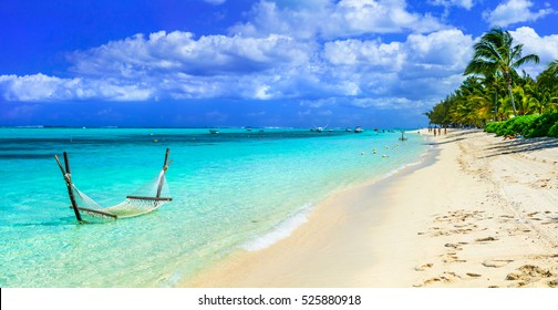 Tropical Chilling Out - Hammock In Turquoise Water. Mauritius Island