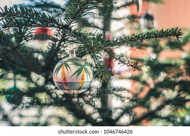 Tropical Christmas Tree. Christmas Decoration Hang On The Tree. Ball With Palms.