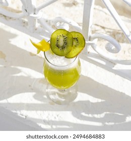 tropical cocktail with kiwi and cherry on a terrace  - Powered by Shutterstock