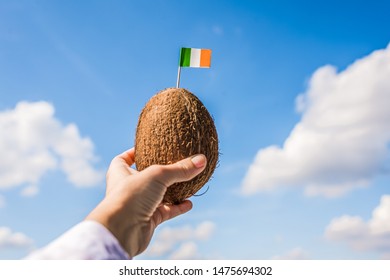 Tropical Coconut With Italy Flag On The Toothpick In Female Hands. Italian Tourist On Vacation.  Travel Concept.