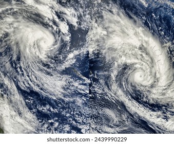 Tropical Cyclone Erica 22P and Tropical Cyclone Eseta 25P, Southern Pacific Ocean. . Elements of this image furnished by NASA. - Powered by Shutterstock