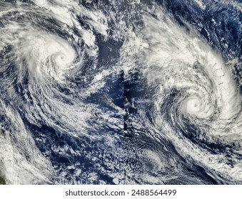 Tropical Cyclone Erica 22P and Tropical Cyclone Eseta 25P, Southern Pacific Ocean.  Elements of this image furnished by NASA. - Powered by Shutterstock