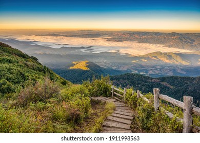 Tropical forest nature landscape view with toursits mountain range and moving cloud mist at Kew Mae Pan nature trail, Doi Inthanon, Chiang Mai Thailand
