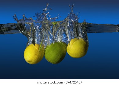 Tropical Fruit Limes And Lemons Dropped In Water