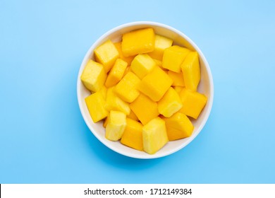 Tropical Fruit, Mango Cube Slices In White Bowl On Blue Background. Top View