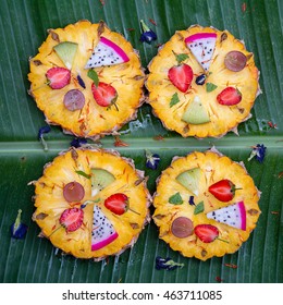 Tropical fruit pizza with pineapple, strawberry, kiwi,grapes, banana and dragon fruit