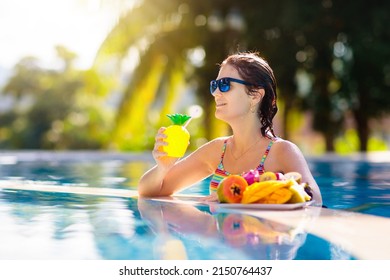 Tropical Fruit Plate At Swimming Pool. Young Woman Eating Mango, Pineapple, Orange And Drinking Fresh Juice On Summer Vacation At Exotic Island. Healthy Nutrition. Beach Holiday And Swim Fun.