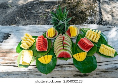 Tropical Fruit Platter on a Sandy Beach with Fresh Pineapple, Watermelon, and Mango, Capturing Island Life and Coastal Relaxation in a Vibrant, Exotic Paradise During a Summer Vacation Getaway - Powered by Shutterstock