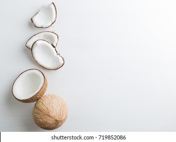 Tropical Fruit Whole And Half Abstract Background .Coconut On White Background. From Top View