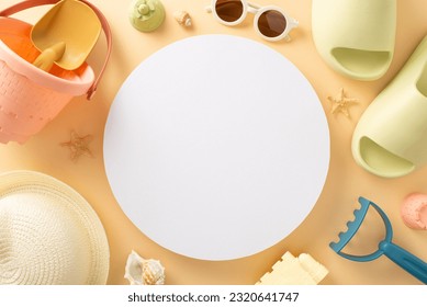 Tropical getaway with baby essentials: top view beach toys, sandcastle set, sunglasses, sunhat, rubber slippers, seashells, starfish on soft beige backdrop, offering circular space for text or advert - Powered by Shutterstock