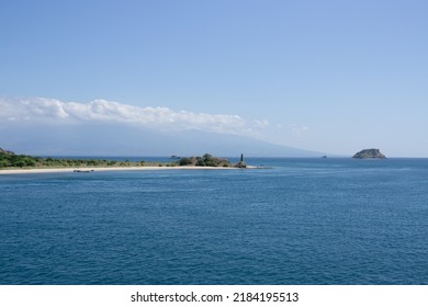 Tropical Green Hill Near Sea Harbor With Blue Sky Background