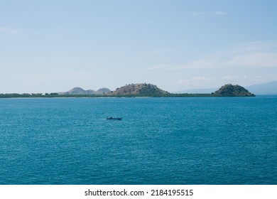 Tropical Green Hill Near Sea Harbor With Blue Sky Background