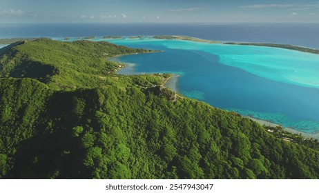 Tropical green mountain Bora Bora island, aerial view. Drone fly over forest coastline with turquoise water, showcasing beauty and tranquility of exotic wild nature. Summer luxury travel background - Powered by Shutterstock