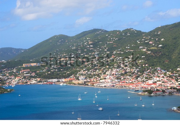 Tropical houses on hill overlooking harbor. St\
John US Virgin Islands