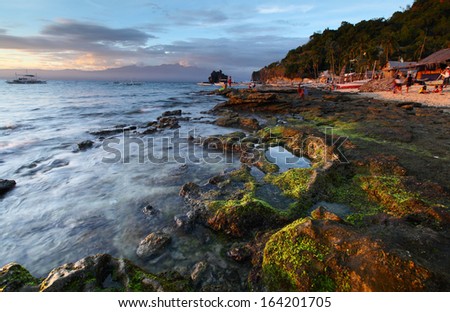 Tropical island of Apo at sunset. Philippines