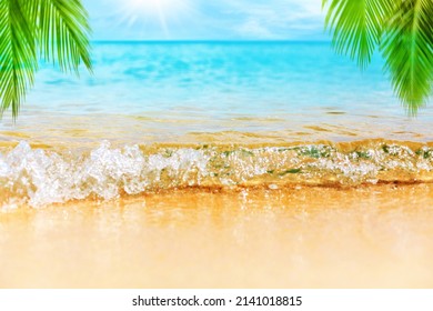 Tropical island beach nature, blue sea wave, turquoise ocean water, yellow sand, green palm tree leaves, sun, sky, white clouds, summer holidays background, vacation concept, travel design, copy space - Powered by Shutterstock