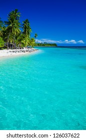 Tropical island in Fiji with sandy beach and pristine water