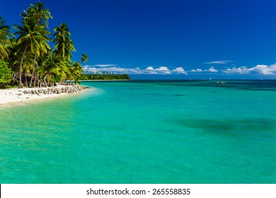 Tropical Island In Fiji With Sandy Beach And Pristine Water