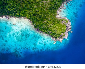 Tropical Island With White Sand Beach And Blue Clear Water And Granite Stones. Top View Of Coral Reef. Thailand.