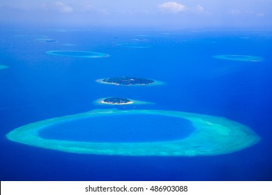 Tropical Islands And Atolls In Maldives From Aerial View. Maldives, Officially The Republic Of Maldives Is An Island Country In The Indian Ocean. It Lies Southwest Of India And Sri Lanka.