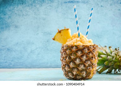 Tropical juice granita served in pineapple, copy space. - Powered by Shutterstock