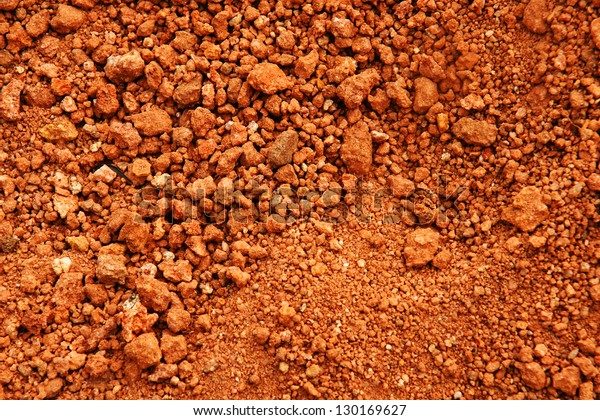 Tropical laterite\
soil or red earth\
background.