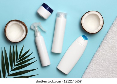 Tropical Leaf, Cosmetic Care Products And Coconut On A Colored Background Top View. Hair, Skin Or Body Products.
Flatlay