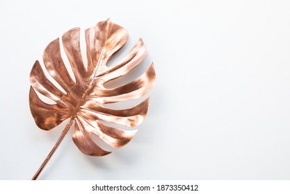 Tropical Leaves In Gold Color On White Space Background.Abstract Monstera Leaf Decoration Design