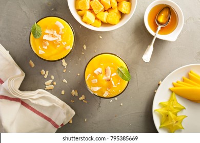 Tropical Mango Smoothie With Honey And Coconut Overhead Shot