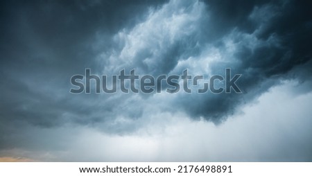 Tropical ominous clouds in front of the hurricane. Awesome photo of the texture of storm clouds. Adverse weather conditions. Climate change. Wallpaper force of nature. Discover the beauty of earth.