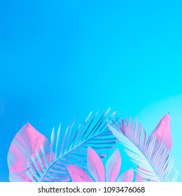 Tropical And Palm Leaves In Vibrant Bold Gradient Holographic Neon  Colors. Concept Art. Minimal Surrealism Summer Background.