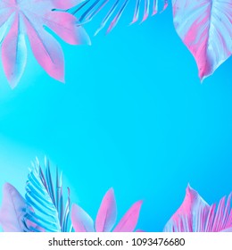 Tropical And Palm Leaves In Vibrant Bold Gradient Holographic Neon  Colors. Concept Art. Minimal Surrealism Summer Background.