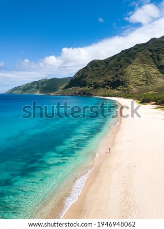 Tropical paradise beach with white sand and mountain background travel tourism wide panorama background. Hawaiian beach. West Oahu. Makua beach. 