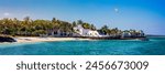 Tropical paradise, best beaches of Mauritius island, luxury resorts. Recreational tourism landscape. Luxurious beach resort with spa swimming pool and beach chairs or leisure loungers under umbrellas.