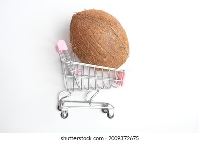 Tropical plant coconut in a grocery cart. 