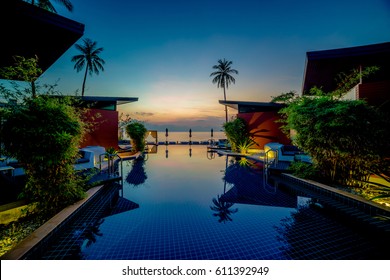 Tropical Resort With The Swimming Pool In The Early Sunrise