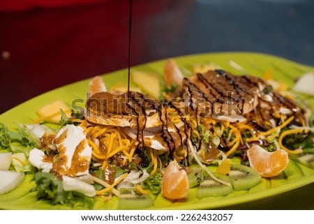 tropical salad on a leaf shaped plate
