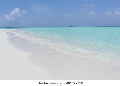 Tropical sand beach and blue sky with white clouds - Shutterstock ID 491777719